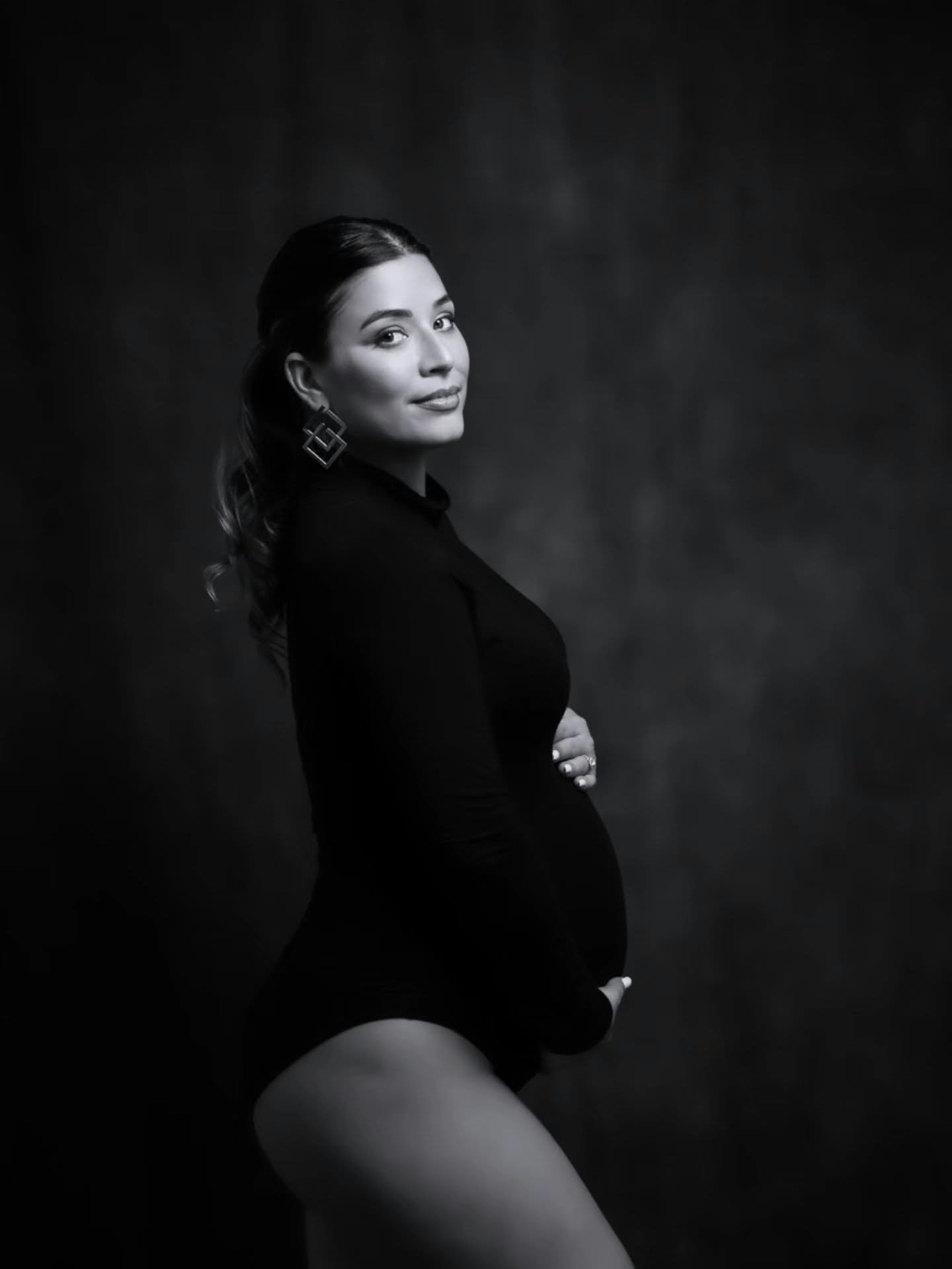 Black and white studio maternity portrait